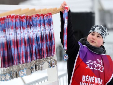 A volunteer prepares the medals at the Gatineau Loppet in Gatineau on Sunday.