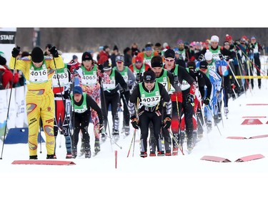 Competitors start in waves for the 27 km Freestyle event at the Gatineau Loppet. In Gatineau on Sunday.