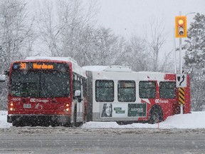 OC Transpo bus stuck in the snow on St. Laurent Blvd. in Ottawa Thursday Feb 27, 2020.