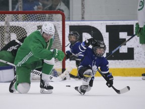 Maple Leafs Mitch Marner teaches Kyle Clifford's son Brody the fist pump celebration after Brody beat goalie Jack Campbell during a little one-on-one play at the end of practice in Toronto on Wednesday.Jack Boland/Toronto Sun/Postmedia Network