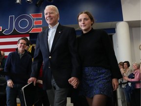 Democratic U.S. presidential candidate Joe Biden and his granddaughter, Finnegan, arrive at a campaign event in Dubuque, Iowa, on Feb. 2, 2020.