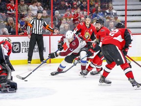 Valeri Nichushkin of the Colorado Avalanche drives to the net as Senators’ Nick Paul tries to slow him down during the second period of Thursday night’s game at the Canadian Tire Centre. (WAYNE CUDDINGTON/POSTMEDIA NETWORK)