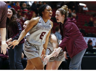 Gee Gee Tyra Blizzard is cheered on by teammates as she is introduced in the women's Capital Hoops Classic basketball game between the University of Ottawa and Carleton University