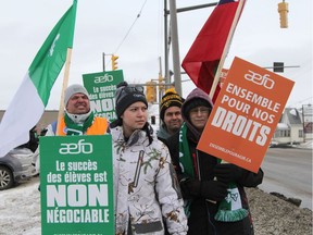 Members of the French-language teachers union on a one-day picket line earlier in March.