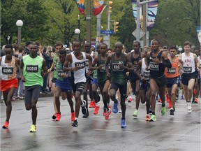 Runners leave the start line of the Scotiabank Ottawa Marathon on Sunday, May 26, 2019.