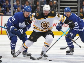 Maple Leafs forwards Kasperi Kapanen (left), Andreas Johnsson (right) or Alexander Kerfoot might have to be traded before next season begins if the salary cap remains the same as it is or doesn’t increase as much as expected.  Claus Andersen/Getty Images