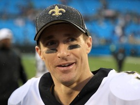 Drew Brees of the New Orleans Saints watches on after defeating the Carolina Panthers 42-10m at Bank of America Stadium on December 29, 2019 in Charlotte, North Carolina.