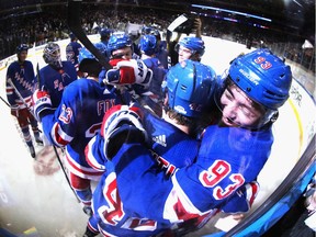 Brendan Lemieux and Mika Zibanejad (93) of the New York Rangers celebrate an overtime victory over the Washington Capitals at Madison Square Garden on March 05, 2020 in New York City. Zibanejad had five goals in the game.