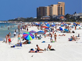 People visit Clearwater Beach in Florida during the COVID-19 pandemic on March 20, 2020.