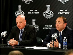 FILE PHOTO: NHL deputy commissioner Bill Daly (left) and NHL Commissioner Gary Bettman answers questions from the media at a press conference.