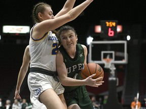 Ryerson Rams' Emma Fraser (25) tries to block UPEI Panthers' Jenna Mae Ellsworth (4) during first half quarterfinal U Sports Final 8 Championships basketball action in Ottawa, on Thursday, March 5, 2020