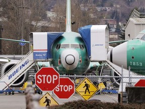 Boeing 737 Max jets sit parked in Renton, Wash. on Dec. 16, 2019. Internal government documents about the Boeing 737 Max are raising new questions about Canada's aircraft approval process.
