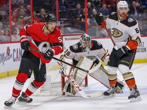 Artem Anisimov moves to make a play as goalie John Gibson and defender Erik Gudbranson look for the puck as the Ottawa Senators take on the Anaheim Ducks in NHL action at the Canadian Tire Centre in Ottawa., Feb. 4, 2020.