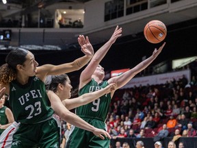 Lauren Rainford (23) of UPEI watches as teammate Reese Baxendale (9) puts up a shot against Brock in the first half of their women's semifinal game on Saturday.