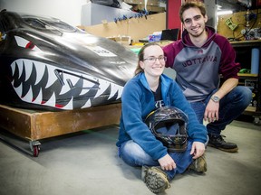 Justine Boudreau and Simon Tremblay with Bruce, the electric-powered vehicle, Saturday at the University of Ottawa. The two, along with the rest of the team, had hoped to take Bruce to Sonoma, California, to compete in the Shell Eco-Marathon Americas. The event was canceled due to the novel coronavirus.