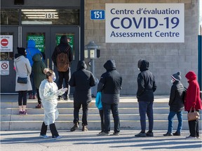 People line up at the COVID-19 Assessment Centre at Brewer Park Arena.