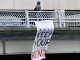 A "Keep Your Rent" banner hangs from the Laurier Avenue Bridge last week.