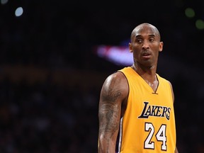 In this file photo taken on November 21, 2015 Kobe Bryant of the Los Angeles Lakers looks on during the Lakers NBA match up with the Toronto Raptors, at Staples Center in Los Angeles, California. The Raptors defeated the Lakers 102-91.