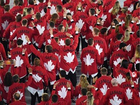In this file photo taken on August 5, 2016 Canada's delegation parade during the opening ceremony of the Rio 2016 Olympic Games at the Maracana stadium in Rio de Janeiro — Canada pulled out of the Tokyo Olympics over coronavirus fears as Japan's prime minister admitted on March 23, 2020 a delay may be "inevitable" and the International Olympic Committee said a decision should come within weeks.