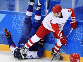 Artyom Zub, right, in action with Russia's team against Slovakia in the 2018 Winter Olympic Games.