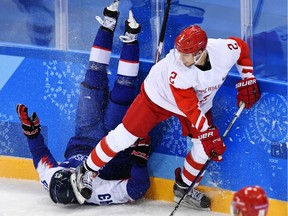 Russia's Artyom Zub, right, battles Slovakia's Tomas Syrovy during the Pyeongchang 2018 Winter Olympic Games at the Gangneung Hockey Centre in Gangneung in February 2018.