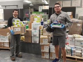 Algonquin College is donating thousands of masks, gloves and other protective equipment to hospitals and loaning out its ventilators for COVID-19 response. Above are Kyle Jamieson, shipping and receiving clerk, right, and Robert Goulet, supply clerk.