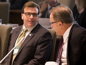 Saskatchewan Minister of Rural and Remote Health Greg Ottenbreit, left, and Saskatchewan Minister of Health, Jim Reiter, right, attend the provincial and territorial health ministers’ conference on Oct. 19, 2017 in Edmonton. (Greg Southam/Postmedia Network files)