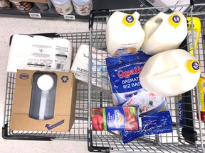 A customer's cart filled with the supplies they're purchasing in response to news about the novel coronavirus.