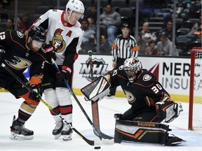 FILE: Anaheim Ducks defenceman Matt Irwin and Ottawa Senators left wing Brady Tkachuk battle for the puck off a rebound by goalie Ryan Miller during the first period at Honda Center.
