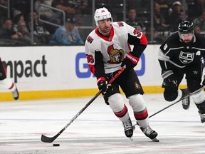 Mar 11, 2020; Los Angeles, California, USA; 

Ottawa Senators center Colin White handles the puck against the Los Angeles Kings in the third period at Staples Center on March 11, 2020.  The Kings won 3-2.