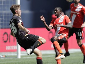 Valour FC Tyler Attaro (left) goes against Cavalry FC Malyk Hamilton during CPL action in Winnipeg at IG Field July 27, 2019.