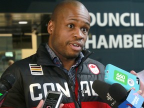 In this April 16, 2018 file photo, Olympic athlete Seyi Smith speaks to media outside council chambers after city council voted to keep the Olympic bid process alive. (Dean Pilling/Postmedia Network)