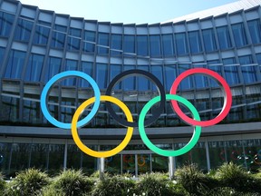 The Olympic rings are pictured in front of the International Olympic Committee during the coronavirus outbreak in Lausanne, Switzerland, March 24, 2020. (REUTERS/Denis Balibouse)
