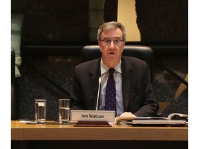 Ottawa Mayor Jim Watson speaking to an almost empty council chambers in Ottawa Wednesday March 25, 2020.