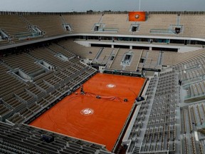 This file photo taken on June 4, 2019, shows a general view of the empty Philippe Chatrier court during rain, at the French Open in Paris.