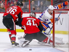 Jean-Gabriel Pageau misses a chance to score with Colin White defending in the second period as the Ottawa Senators take on the New York Islanders in NHL action at the Canadian Tire Centre.