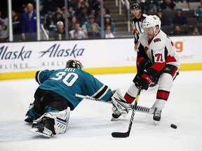 San Jose Sharks goaltender Aaron Dell stops Ottawa Senators forward Chris Tierney on a penalty shot during the second period in San Jose, Calif. Tierney would get some revenge by scoring the overtime winner for Ottawa. (Josie Lepe/The Associated Press)