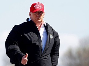 U.S. President Donald Trump gestures as he boards Air Force One at Nashville International Airport in Nashville, Tennessee, U.S., March 6, 2020.