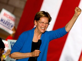In this file photo Democratic U.S. presidential hopeful Massachusetts Sen. Elizabeth Warren gestures as she speaks during a campaign rally at Eastern Market in Detroit on March 3, 2020.