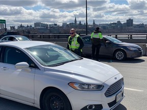 Quebec police on the Macdonald Cartier bridge.