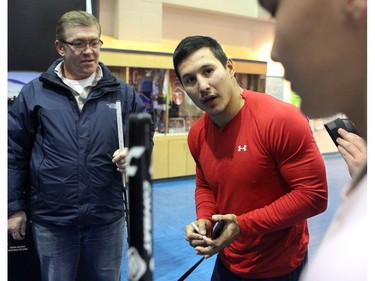YELLOWKNIFE, N.W.T. NOVEMBER 18,  2012 --- A number of Ottawa Senators and other NHL players arrived in Yellowknife in the Northwest Territories Sunday to begin their Northern Lights Dream Tour, which will include three exhibition games in Yellowknife, Inuvik, and Whitehorse (Yukon). Here, native player Jordan Tootoo signs some sticks for local kids before the game.