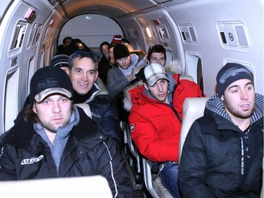 Here, the team, along with organizer and former NHLer John Chabot (second from left)  packs into a tiny charter en route to Inuvik.