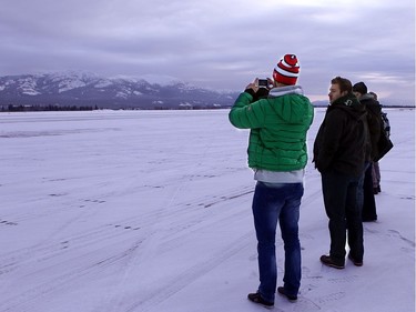 WHITEHORSE, YUKON. NOVEMBER 21,  2012 --- Players Peter Regin (green), Grant Clitsome (centre) and Guillaume Latendresse take in the stark beauty of the Yukon upon arriving at the airport for their last game.   The Northern Lights Dream Tour wound up Wednesday with a final game in Whitehorse, Yukon, followed by long flights home on Thursday for the players - many with three connections and 15 to 20 hours in the air.