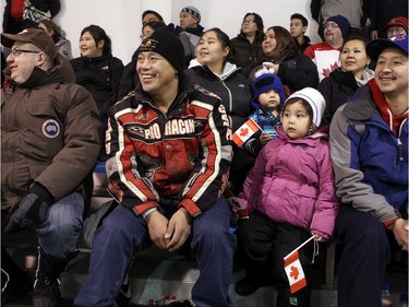 INUVIK, N.W.T. NOVEMBER 20,  2012 --- Northern Lights Dream Tour continues through the north, with another game in Inuvik - a town of about 3,500 people located 200 kilometres north of the Arctic Circle. Fans (from left) Chris Lake, Warren Pokiak,  Ryhan-Joy Wolki, 3, and her dad Churchill Wolki II were excited to see some big names in their arena. "This is great. We don't get to see big names like these guys here very often," said Churchill Wolki.