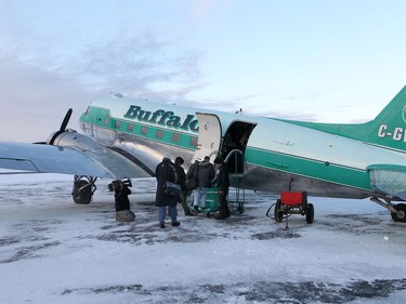 YELLOWKNIFE, N.W.T. NOVEMBER 19,  2012 ---  Day Two of the Northern Lights Dream Tour, which saw players leaving Yellowknife on a 1942 DC 3 (used in WWII over Normandy) for hunting and fishing in Deline.  Here, the last of the crew board the vintage plane for the two and a half hour flight north to Deline - population 500 or so.  ----------------
