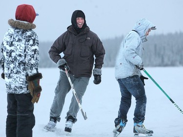 Marc Mehtot, centre) during their visit to Deline The small native community of 600 people is the birthplace of hockey, where skating with stick was first recorded in 1825.