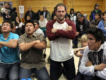 DELINE, N.W.T. NOVEMBER 19,  2012 --- Chris Phillips (centre) takes part in traditional hand games during a celebration in Deline.