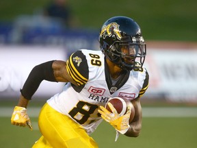 FILES: TiCats Jalen Saunders catches then runs with a kick off return during CFL action between the Hamilton Tiger Cats and the Calgary Stampeders  in 2017