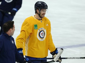 The Jets' Adam Lowry (right) had just returned from injury when the pandemic hit.