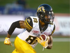 Jalen Saunders returns a kickoff for the Hamilton Tiger-Cats in a game at Calgary in July 2017.